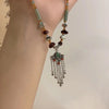 collier-chinois-style-ruyi-pompon
