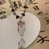 collier-chinois-style-ruyi-pompon