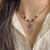 collier-chinois-style-ruyi-pompon